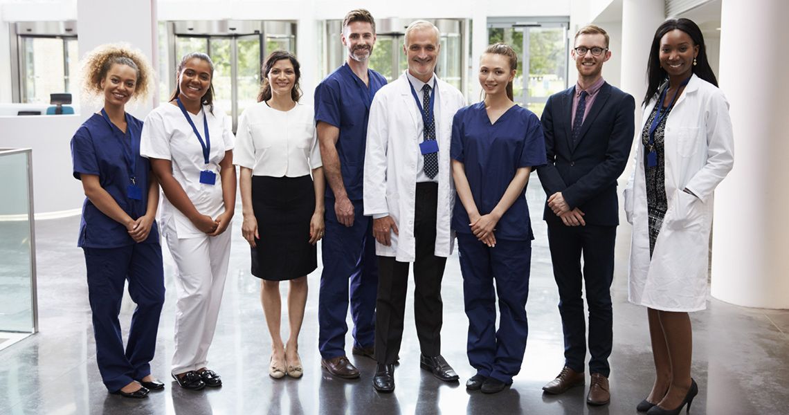 Medical Staff standing together in a hospital lobby
