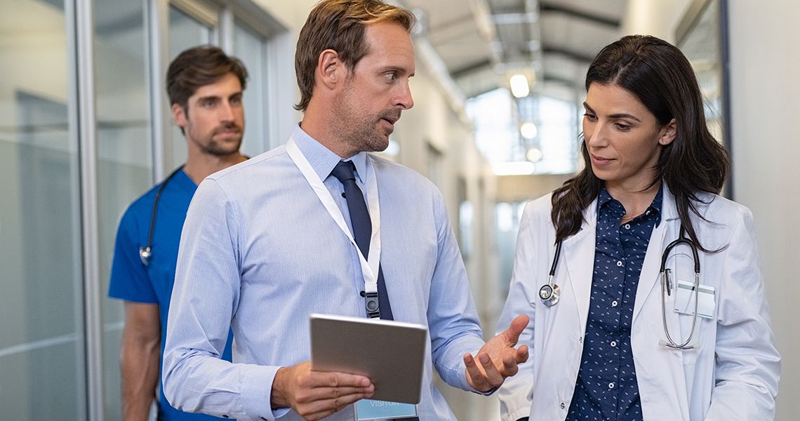 Doctors and hospital staff walking and talking